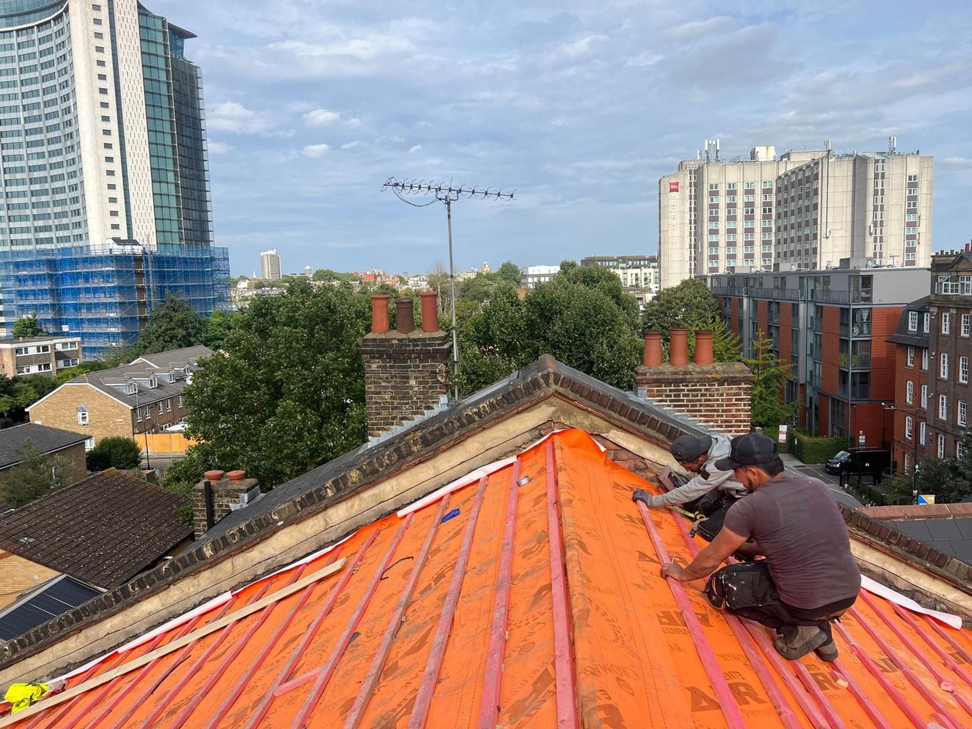 M.N.O roofer fitting new battens and membrane on a London roof